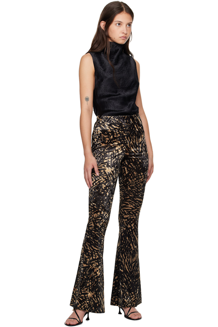 Stretch polyester crushed velvet leggings. Graphic pattern throughout.

· High-rise
· Elasticized waistband
· Flared cuffs

Supplier color: Fur stroke animal