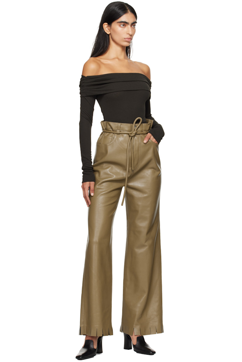 Loose-fit coated vegan leather trousers. 

· Belt loops with detachable self-tie belt 
· Five-pocket styling
· Button-fly
· Fringed detailing at cuffs 
· Faux-suede interior 

Supplier color: Muted khaki