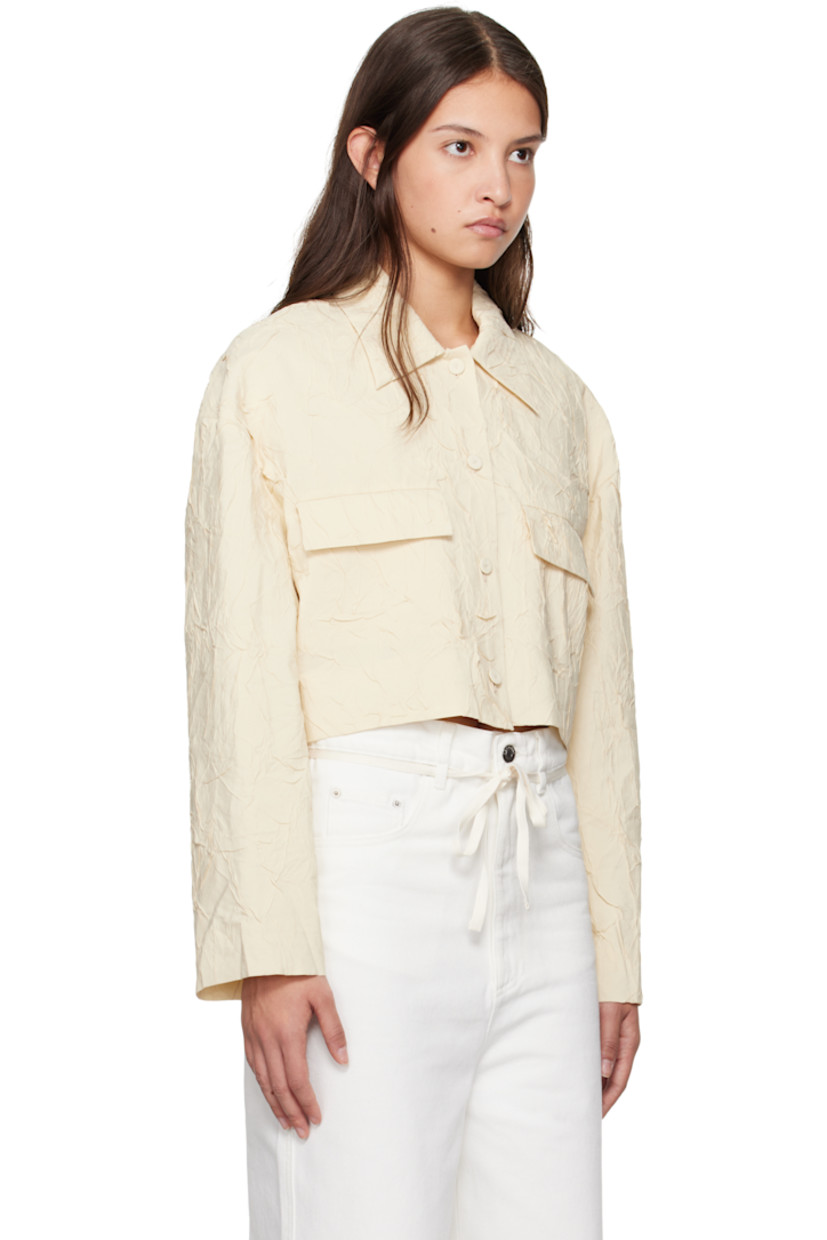 Crinkled viscose-blend poplin shirt.

· Spread collar
· Button closure
· Mock flap pockets 
· Cropped hem
· Full crepe lining

Supplier color: Oat