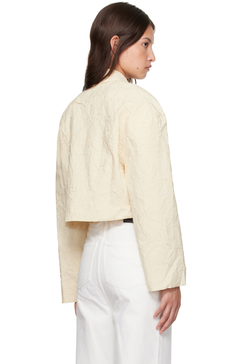 Crinkled viscose-blend poplin shirt.

· Spread collar
· Button closure
· Mock flap pockets 
· Cropped hem
· Full crepe lining

Supplier color: Oat