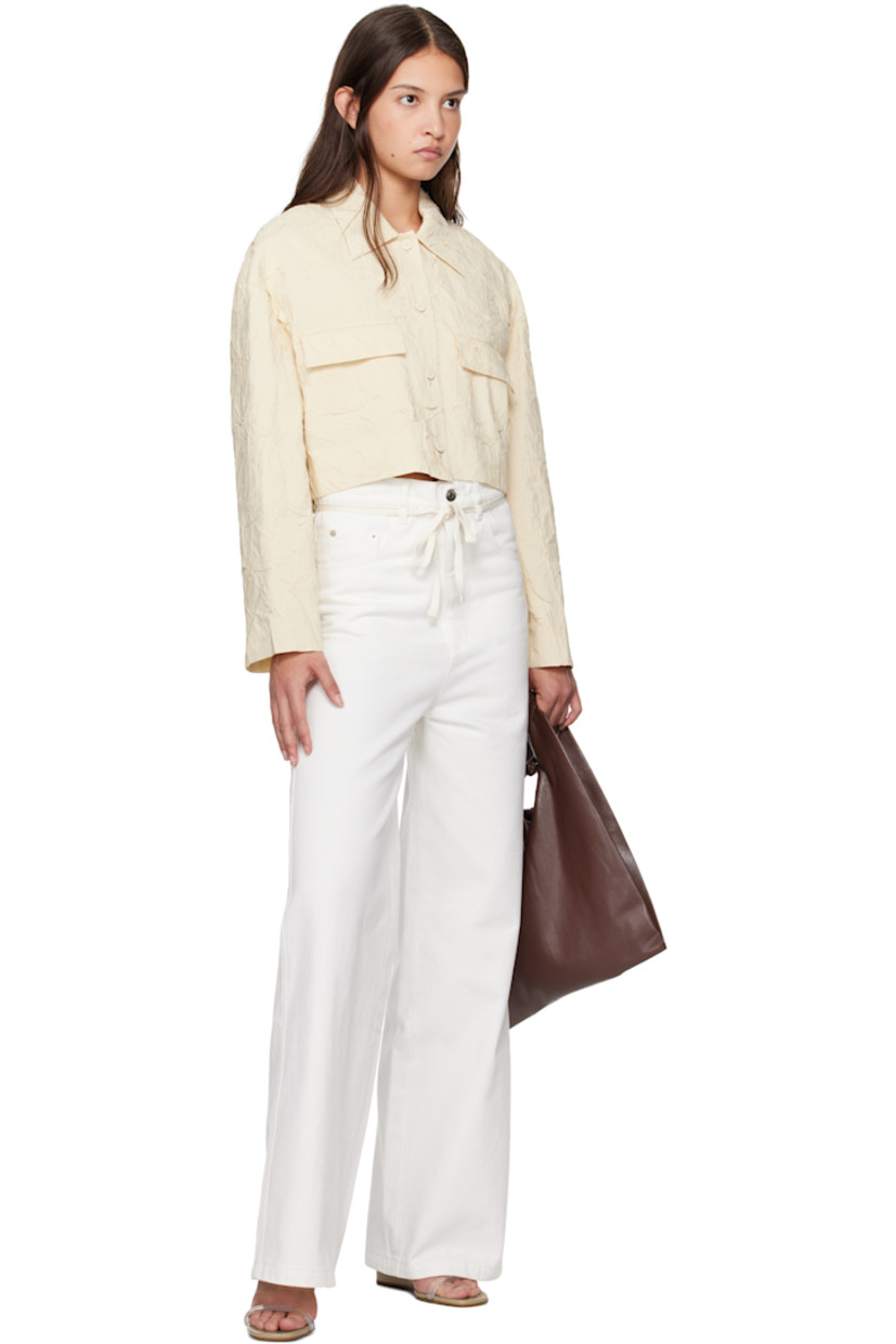 Crinkled viscose-blend poplin shirt.

· Spread collar
· Button closure
· Mock flap pockets 
· Cropped hem
· Full crepe lining

Supplier color: Oat