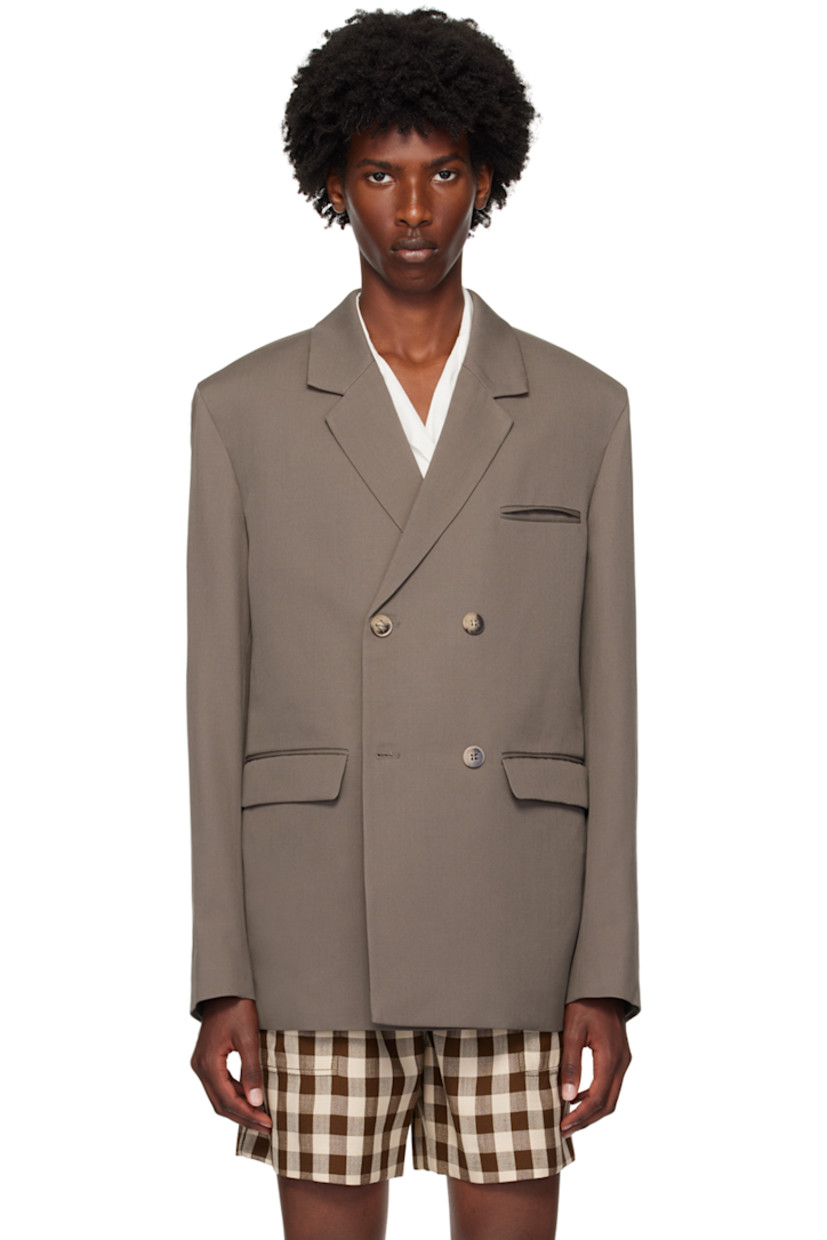 Wool twill blazer.

· Notched lapels 
· Double-breasted button closure
· Welt pocket and flap pockets
· Padded shoulders
· Four-button surgeon's cuffs
· Central vent at back hem
· Welt pockets at interior
· Full satin lined

Supplier color: Gull grey