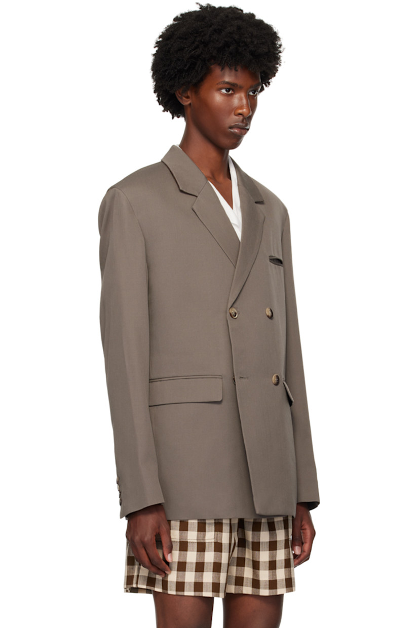 Wool twill blazer.

· Notched lapels 
· Double-breasted button closure
· Welt pocket and flap pockets
· Padded shoulders
· Four-button surgeon's cuffs
· Central vent at back hem
· Welt pockets at interior
· Full satin lined

Supplier color: Gull grey