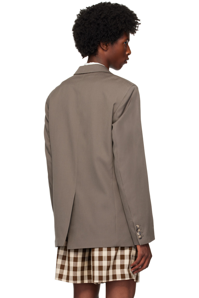 Wool twill blazer.

· Notched lapels 
· Double-breasted button closure
· Welt pocket and flap pockets
· Padded shoulders
· Four-button surgeon's cuffs
· Central vent at back hem
· Welt pockets at interior
· Full satin lined

Supplier color: Gull grey