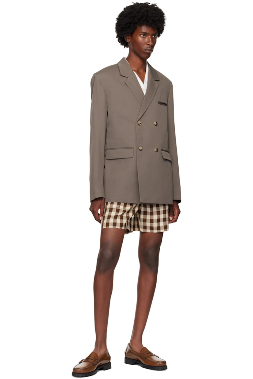 Wool twill blazer.

· Notched lapels 
· Double-breasted button closure
· Welt pocket and flap pockets
· Padded shoulders
· Four-button surgeon's cuffs
· Central vent at back hem
· Welt pockets at interior
· Full satin lined

Supplier color: Gull grey