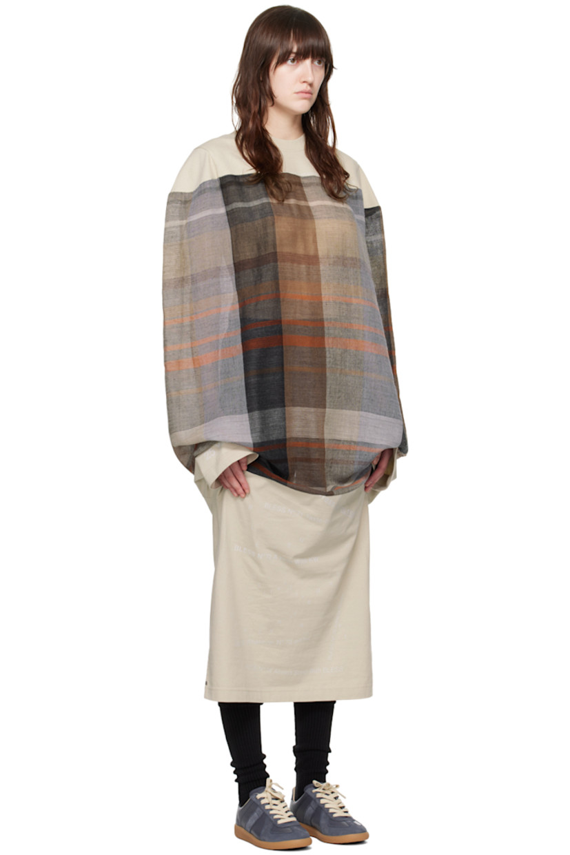 Cotton jersey and semi-sheer wool broken twill dress. Jacquard check pattern throughout.

· Rib knit crewneck
· Text printed at front and cuff
· Dolman sleeves

Supplier color: Sand/Multicolor