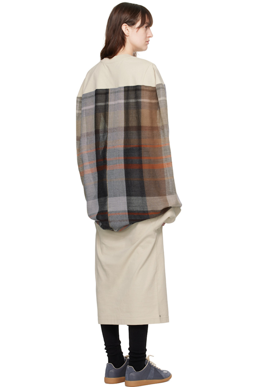 Cotton jersey and semi-sheer wool broken twill dress. Jacquard check pattern throughout.

· Rib knit crewneck
· Text printed at front and cuff
· Dolman sleeves

Supplier color: Sand/Multicolor