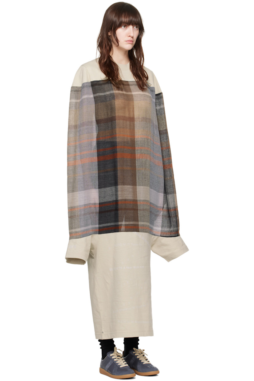 Cotton jersey and semi-sheer wool broken twill dress. Jacquard check pattern throughout.

· Rib knit crewneck
· Text printed at front and cuff
· Dolman sleeves

Supplier color: Sand/Multicolor