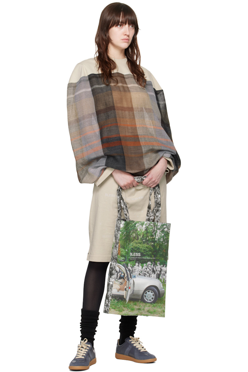 Cotton jersey and semi-sheer wool broken twill dress. Jacquard check pattern throughout.

· Rib knit crewneck
· Text printed at front and cuff
· Dolman sleeves

Supplier color: Sand/Multicolor