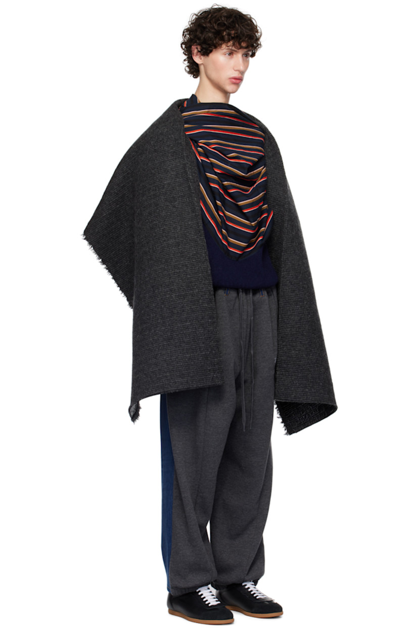 Vinyl-coated knit wool coat. Raw edges throughout.

· Shawl lapel
· Open front
· Seam pockets
· Logo-engraved silver-tone hardware at side seam
· Dropped shoulders

Supplier color: Glossy black