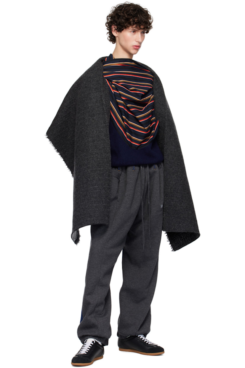 Vinyl-coated knit wool coat. Raw edges throughout.

· Shawl lapel
· Open front
· Seam pockets
· Logo-engraved silver-tone hardware at side seam
· Dropped shoulders

Supplier color: Glossy black