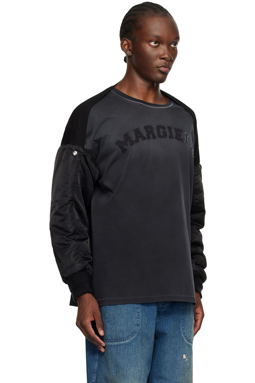 Insulated nylon satin bolero-style bomber jacket.

· Paneled construction
· Utility pocket at sleeve
· Rib knit cuffs
· Logo-engraved silver-tone hardware

Supplier color: Black