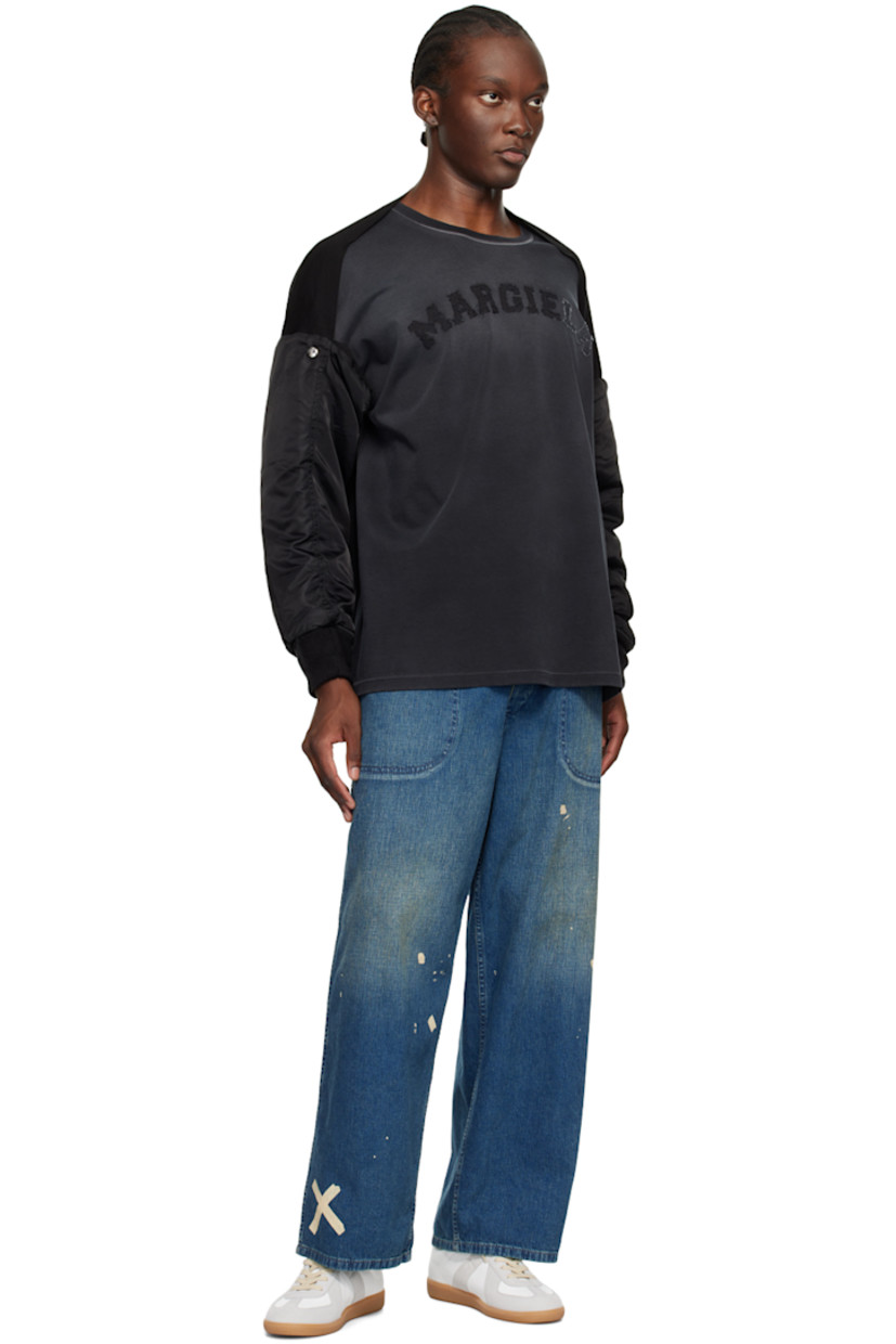 Insulated nylon satin bolero-style bomber jacket.

· Paneled construction
· Utility pocket at sleeve
· Rib knit cuffs
· Logo-engraved silver-tone hardware

Supplier color: Black