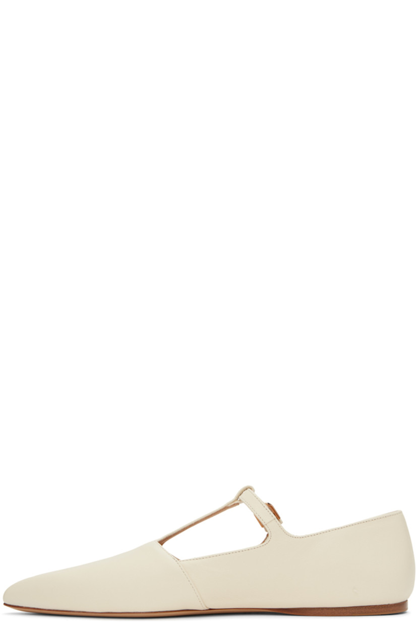 Nappa lambskin ballerina flats in off-white.

· Pointed toe
· Pin-buckle T-bar strap at vamp
· Nappa lambskin lining
· Calfskin sole with rubber injection

Supplier color: Cream