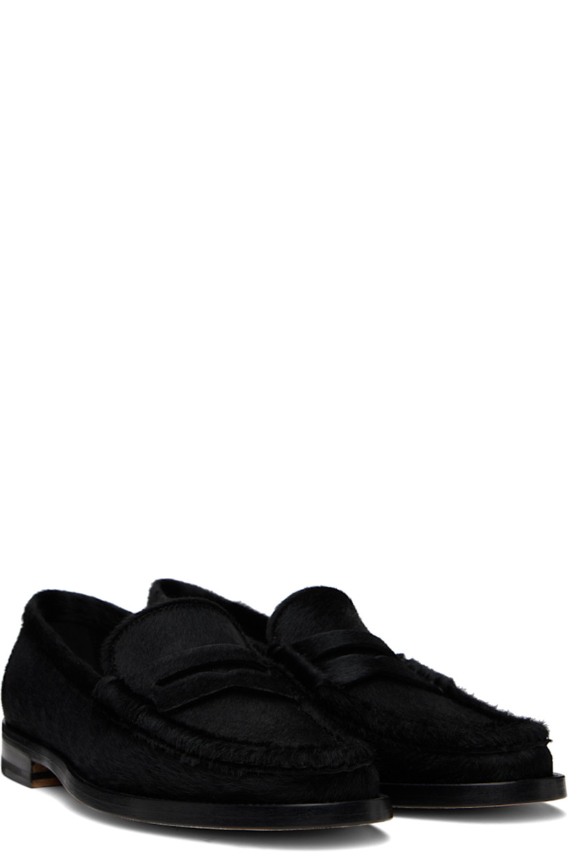Calf-hair loafers in black.

· Moc toe
· Strap with cutout at vamp
· Logo patch at leather footbed 
· Suede and buffed leather lining
· Stacked leather heel with rubber injection
· Calfskin nubuck sole 

Supplier color: Black