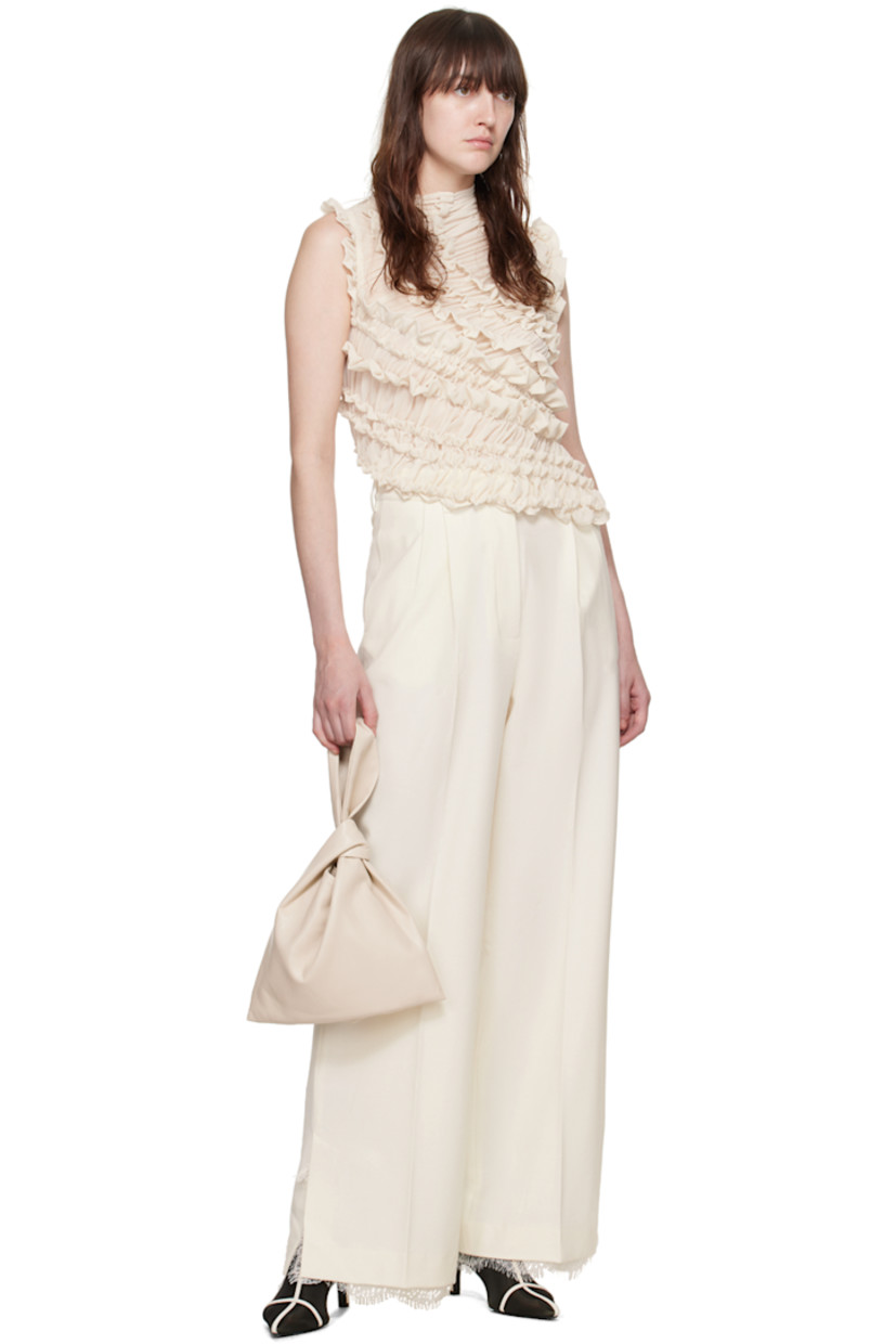 Stretch polyester- and viscose-blend barathea trousers.

· Lace trim at waistband and vented cuffs
· Belt loops
· Four-pocket styling
· Zip-fly
· Pleats at front
· Creased legs

Supplier color: Alabaster