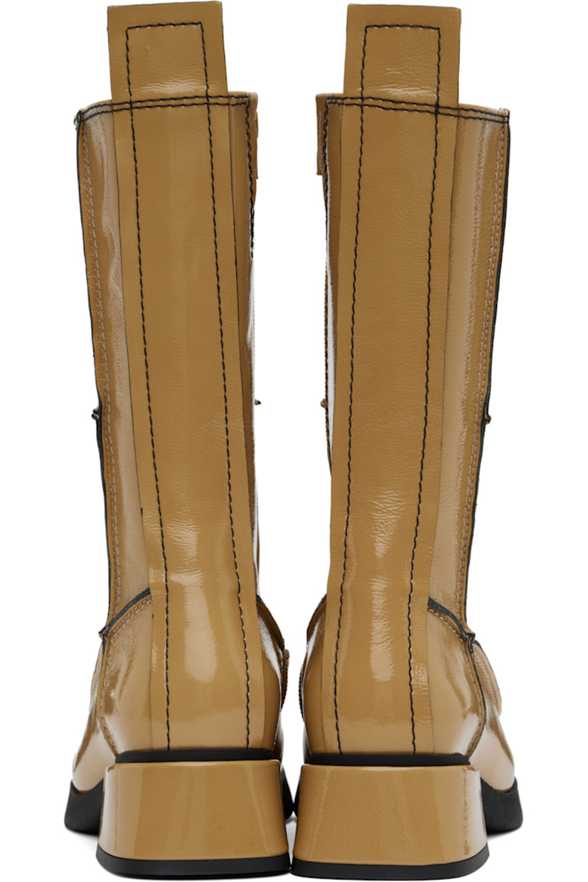 Handcrafted mid-calf grained patent leather boots in beige.

· Paneled construction 
· Inverted seams throughout
· Square moc toe
· Zip closure at inner side
· Concealed elasticized gusset at collar
· Pull-tab at heel collar
· Grained faux-leather lining
· Treaded rubber sole
· Contrast stitching in black
· Heel: H1.75"

Supplier color: Beige/Black