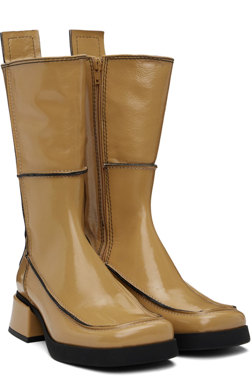 Handcrafted mid-calf grained patent leather boots in beige.

· Paneled construction 
· Inverted seams throughout
· Square moc toe
· Zip closure at inner side
· Concealed elasticized gusset at collar
· Pull-tab at heel collar
· Grained faux-leather lining
· Treaded rubber sole
· Contrast stitching in black
· Heel: H1.75"

Supplier color: Beige/Black