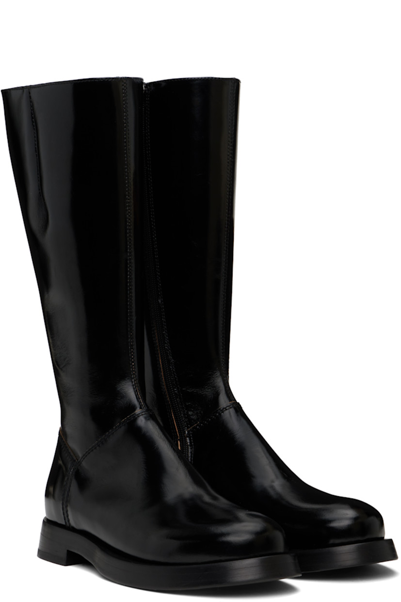 Knee-high patent leather boots in black.

· Elasticized gusset at collar
· Zip closure at side
· Leather logo flag at zip closure
· Stacked leather heel
· Leather sole

Supplier color: Black