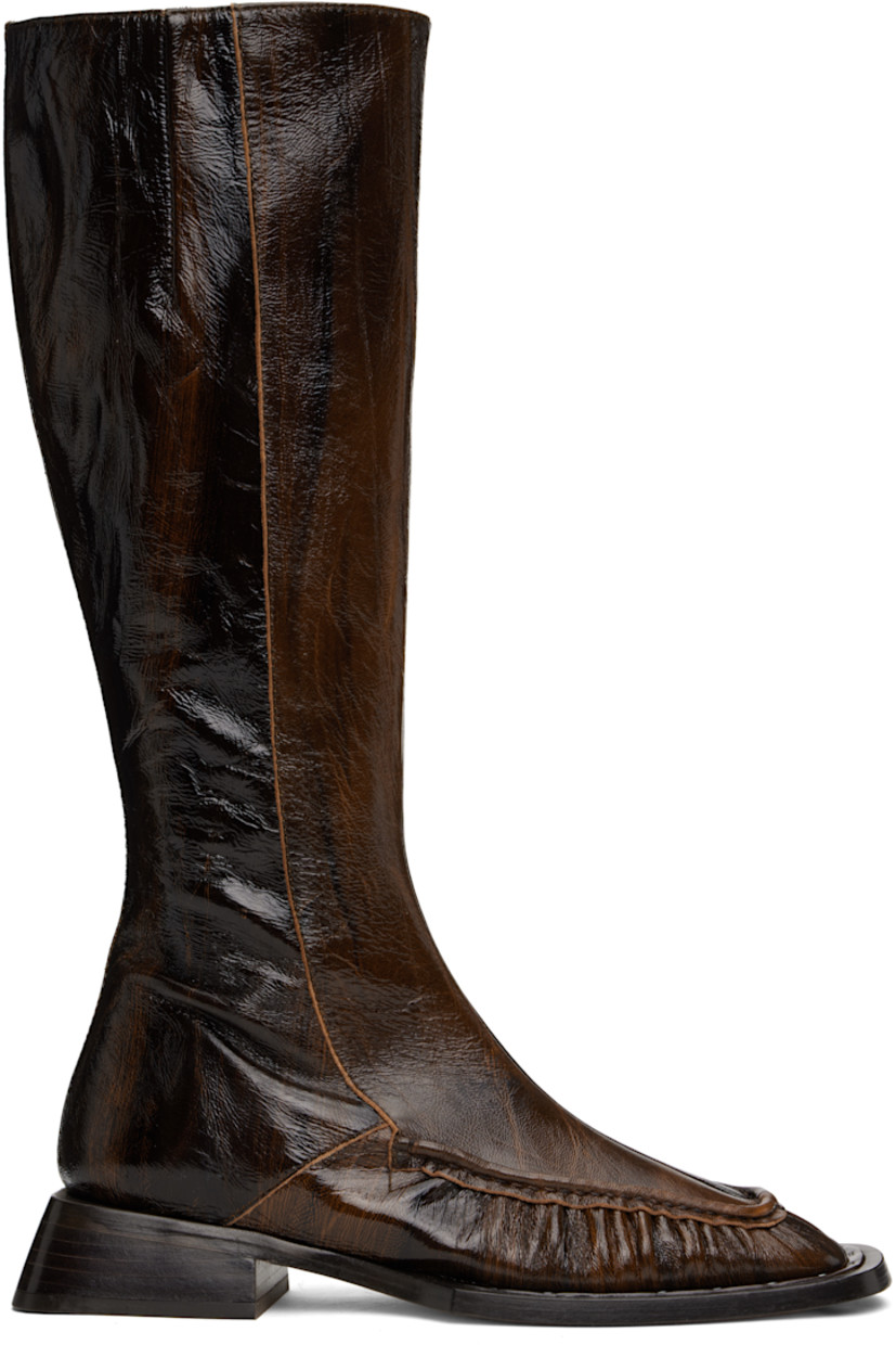 Knee-high crinkled patent sheepskin boots in brown.

· Square moc toe
· Zip closure at inner side
· Concealed elasticized gusset at inner collar
· Memory foam insole
· Buffed leather lining
· Stacked leather block heel with rubber injection
· Leather sole with rubber injection
· Heel: H1.5"

Supplier color: Brown