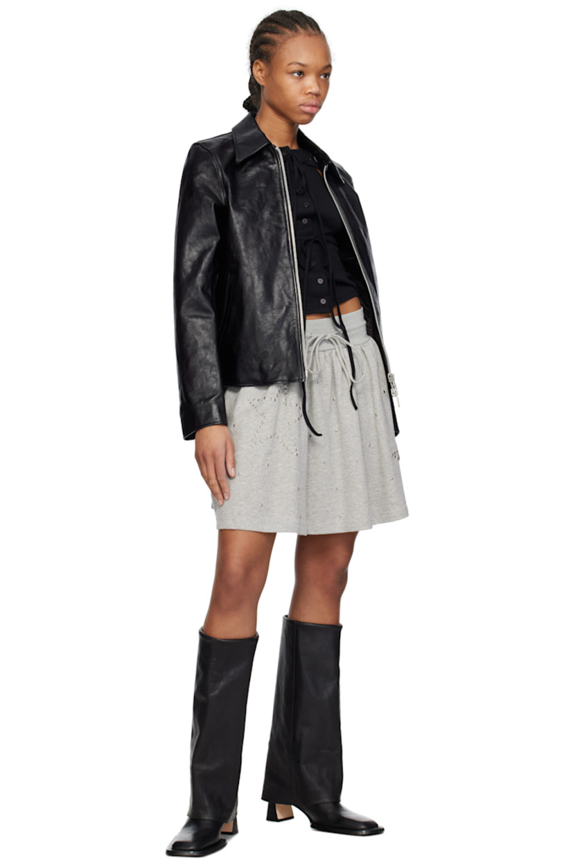 Knee-high grained leather boots in black.

· Square toe 
· Foldover collar
· Zip closure at inner side
· Studs at welt 
· Covered block heel
· Suede sole with rubber injection 
· Silver-tone hardware
· Heel: H2.25"

Supplier color: Black