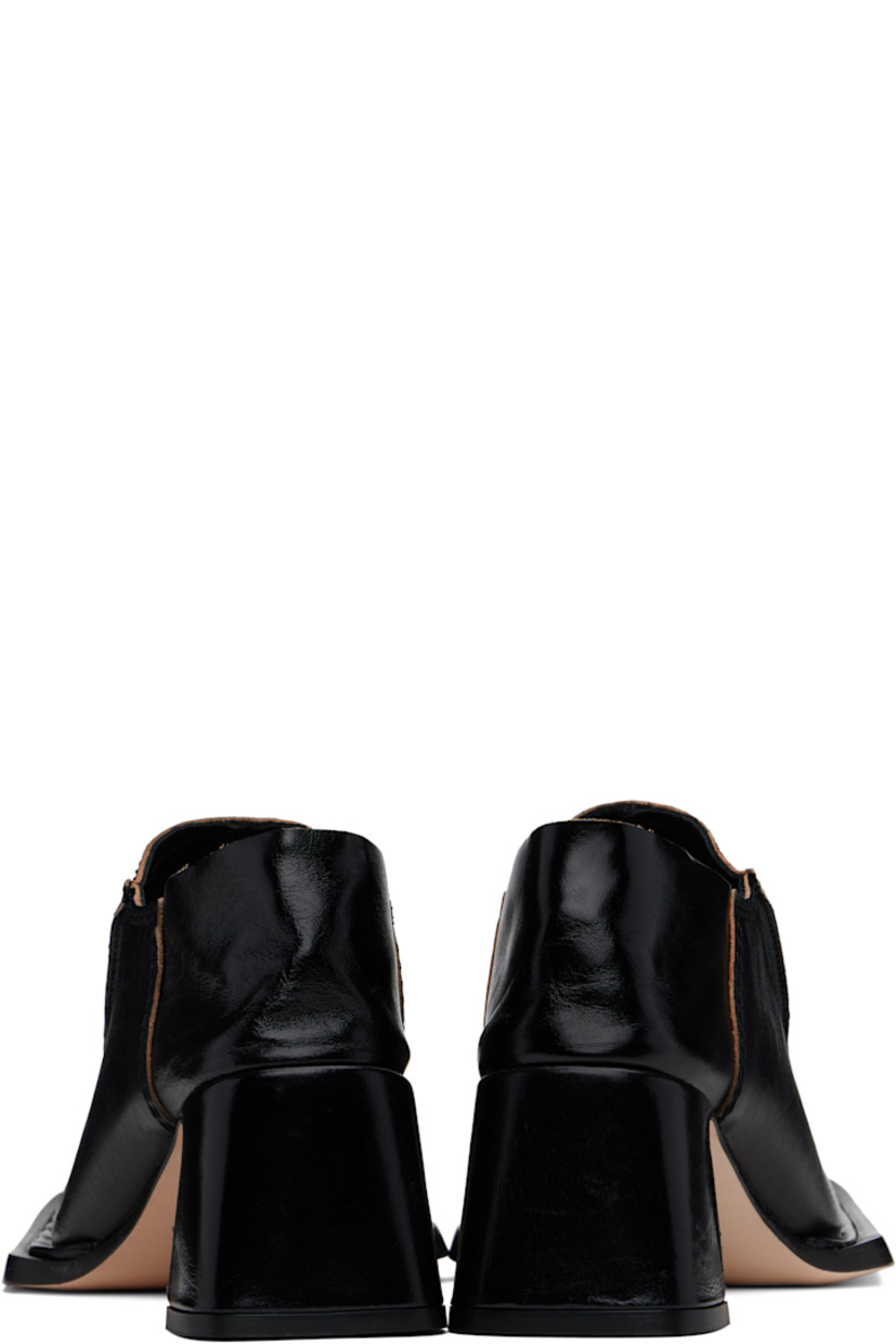 Polished sheepskin heels in black.

· Square toe
· Pinched seams at vamp
· Collapsible heel counter
· Padded leather insole
· Covered block heel with rubber injection
· Nubuck leather sole with rubber injection
· Heel: H2.25"

Supplier color: Black