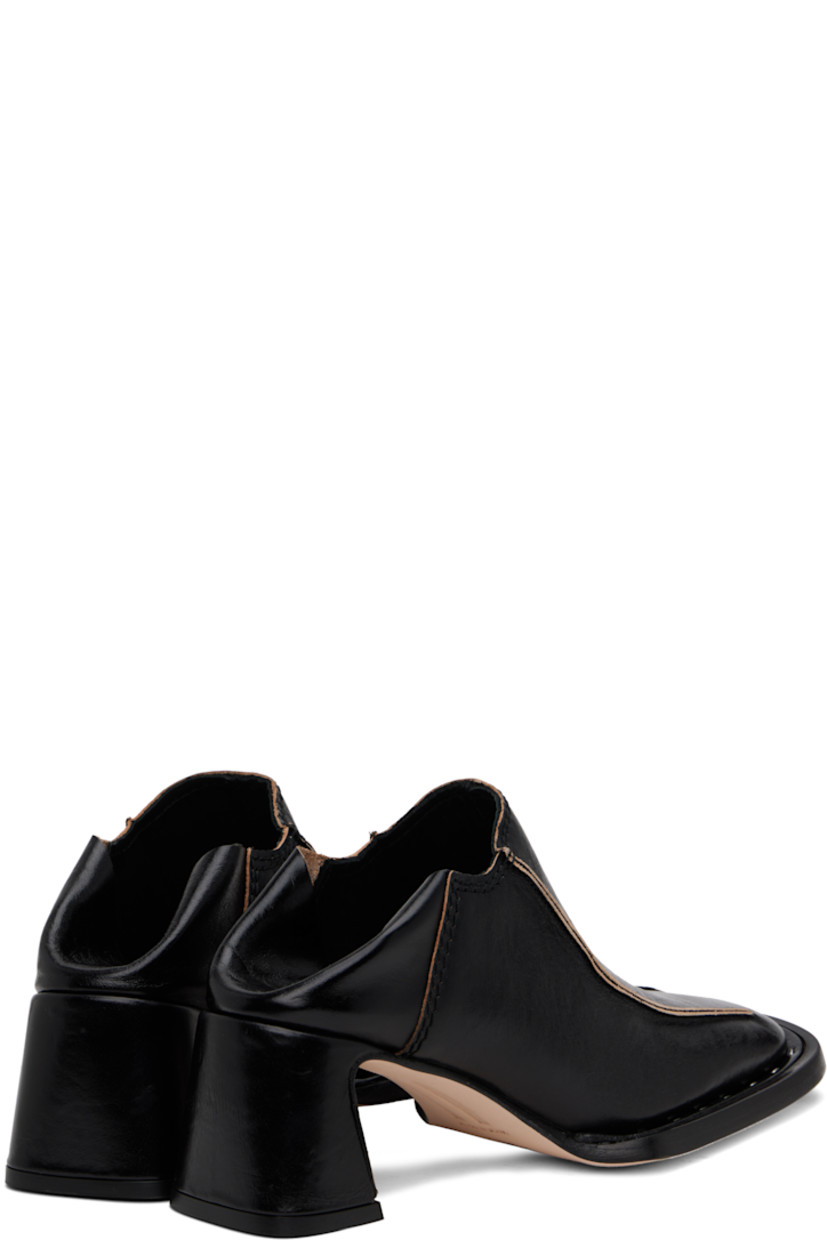 Polished sheepskin heels in black.

· Square toe
· Pinched seams at vamp
· Collapsible heel counter
· Padded leather insole
· Covered block heel with rubber injection
· Nubuck leather sole with rubber injection
· Heel: H2.25"

Supplier color: Black