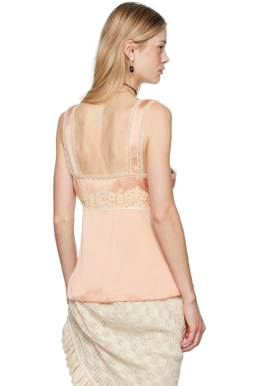 Polyester satin camisole. Lace trim throughout. 

· Plunging V-neck
· Self-tie fastening at open front

Supplier color: Rose multi