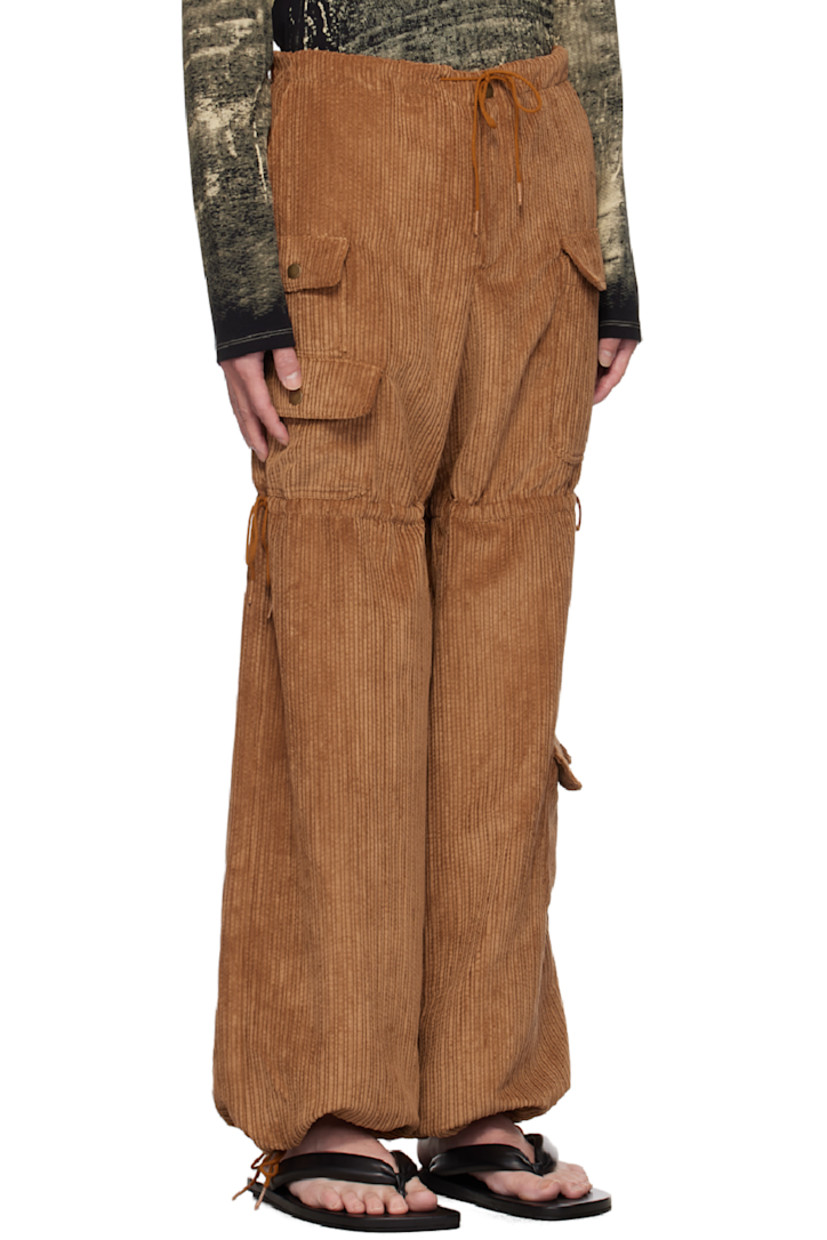 Polyester- and nylon-blend corduroy cargo pants.

· Drawstring at waistband, legs, and cuffs
· Four-pocket styling
· Zip-fly
· Flap pockets at legs

Available exclusively at SSENSE.

Supplier color: Cinnamon