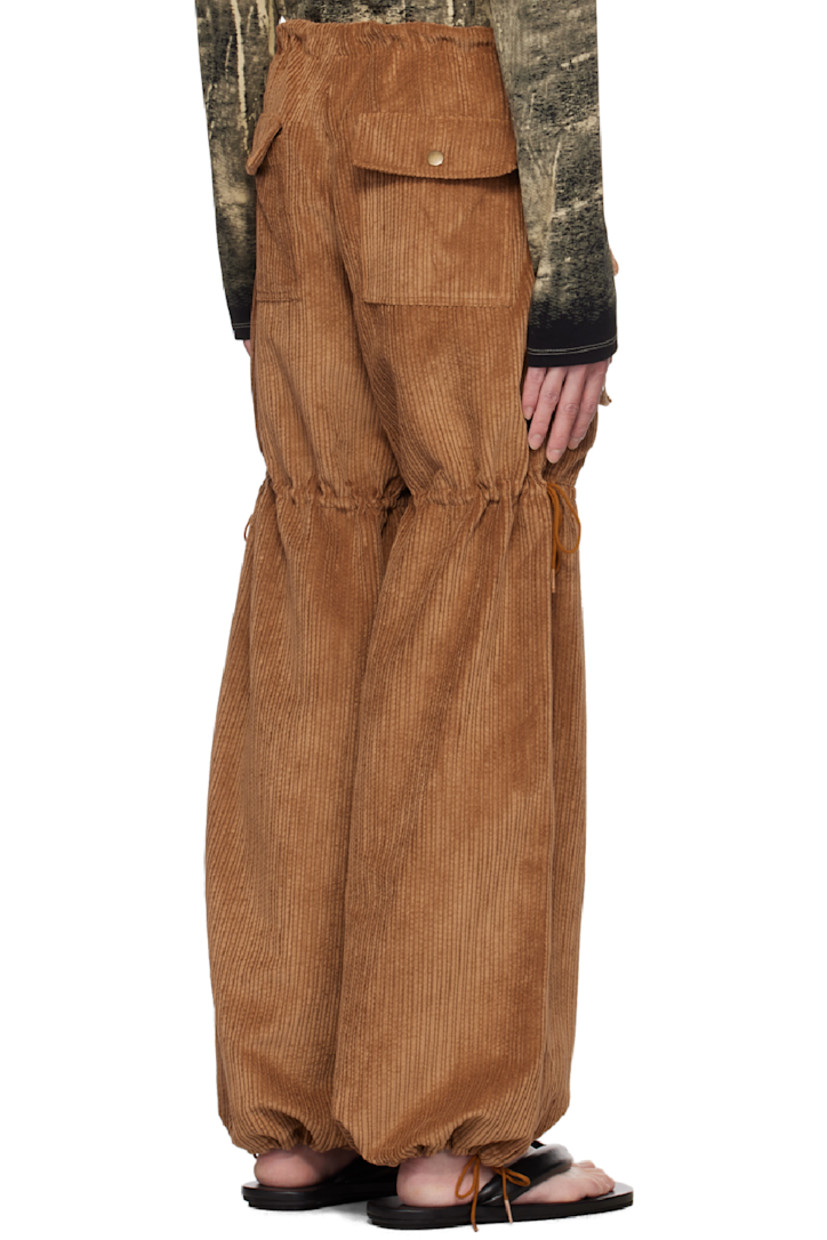 Polyester- and nylon-blend corduroy cargo pants.

· Drawstring at waistband, legs, and cuffs
· Four-pocket styling
· Zip-fly
· Flap pockets at legs

Available exclusively at SSENSE.

Supplier color: Cinnamon