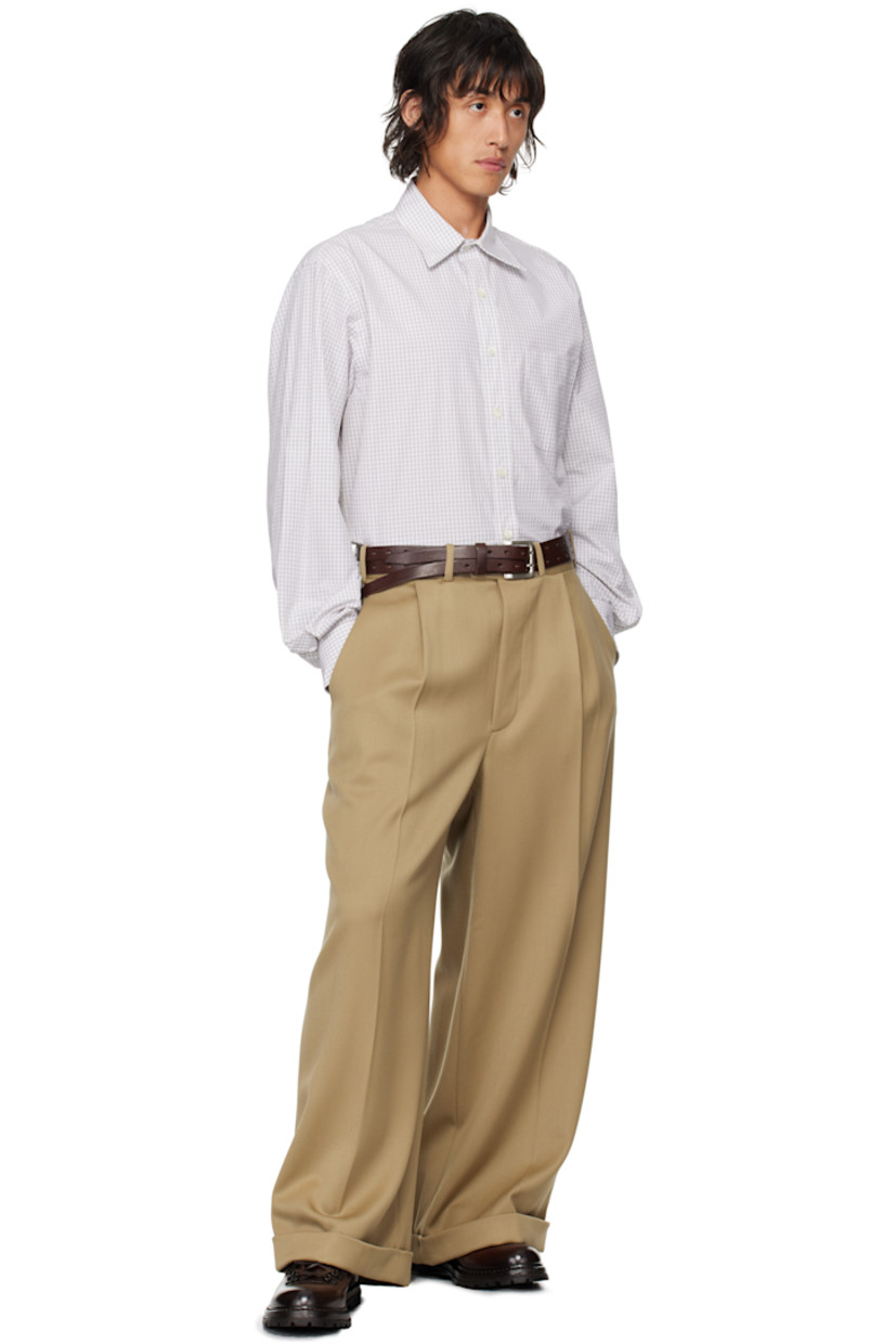 Cotton poplin shirt. Check pattern throughout. 

· Spread collar
· Button closure
· Patch pocket
· Shirttail hem
· Pleated single-button barrel cuffs
· Box pleat at back yoke

Supplier color: Natural