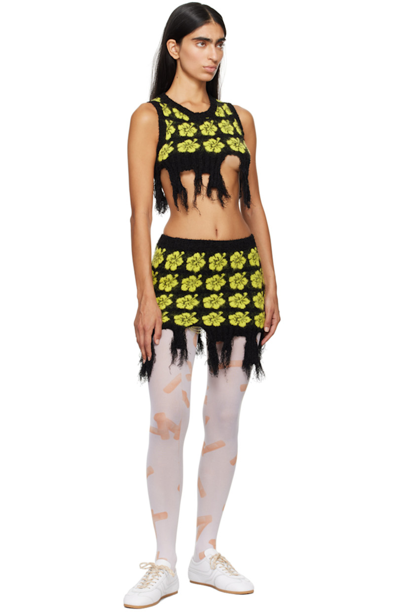Knit stretch cotton-blend bouclé skirt. Jacquard floral pattern throughout.

· Elasticized waistband
· Rib knit trim at waist and hem
· Frayed edge at asymmetric hem

Supplier color: Yellow