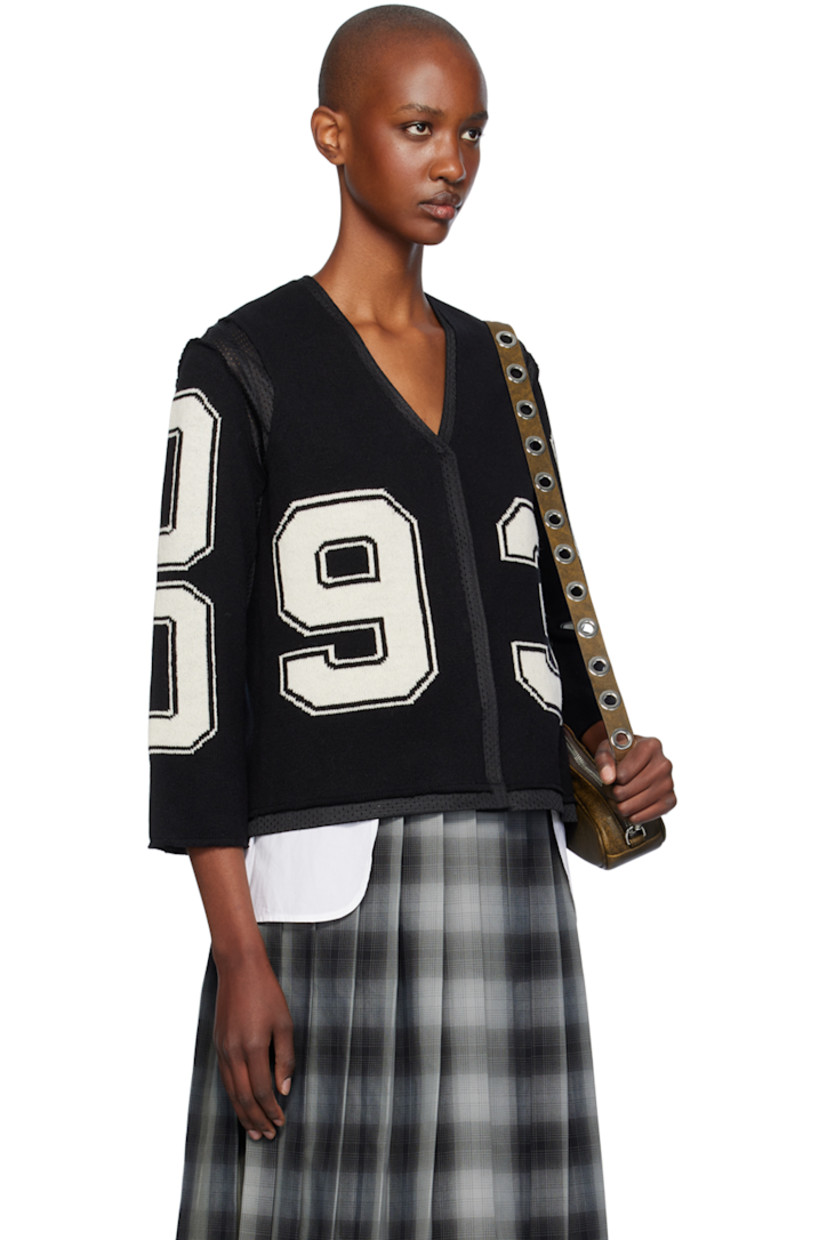 Knit merino lambswool and polyester mesh cardigan. Raw edges and intarsia text throughout.

· Paneled construction
· Y-neck
· Press-stud closure
· Full mesh lining

Supplier color: Black