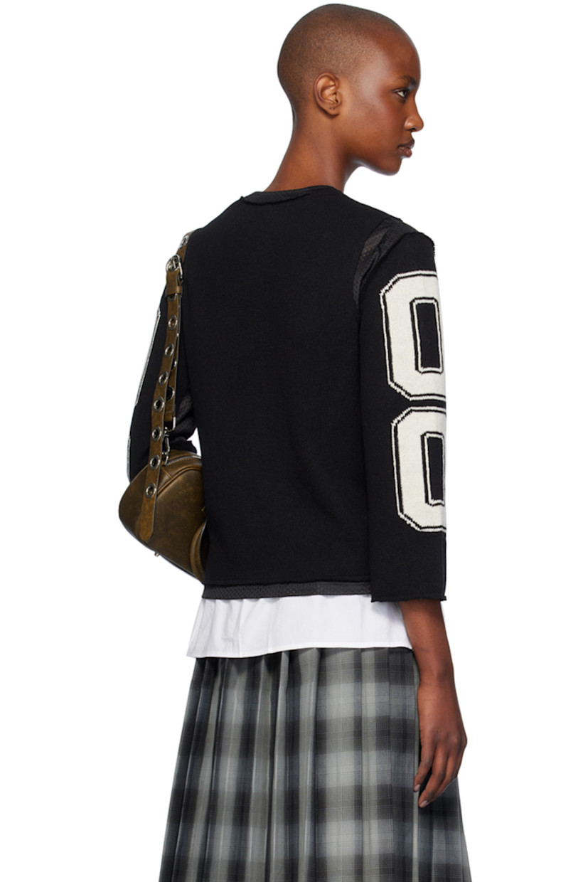 Knit merino lambswool and polyester mesh cardigan. Raw edges and intarsia text throughout.

· Paneled construction
· Y-neck
· Press-stud closure
· Full mesh lining

Supplier color: Black