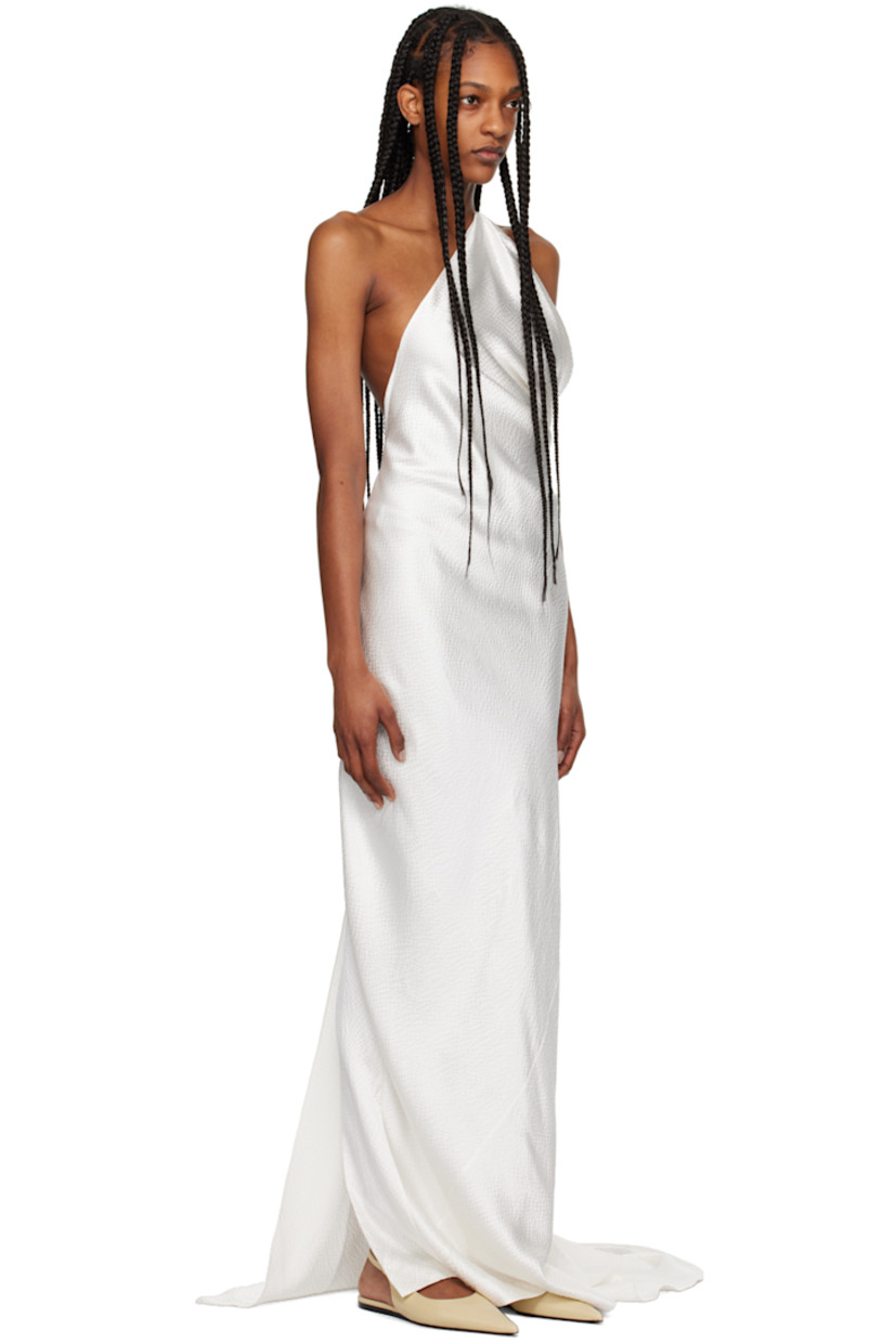 Silk seersucker dress. Draping throughout.

· Single-shoulder construction
· Spaghetti strap at open back
· Zip closure and extended trim at back 
· Central vent at back hem
· Full silk voile lining

Supplier color: White