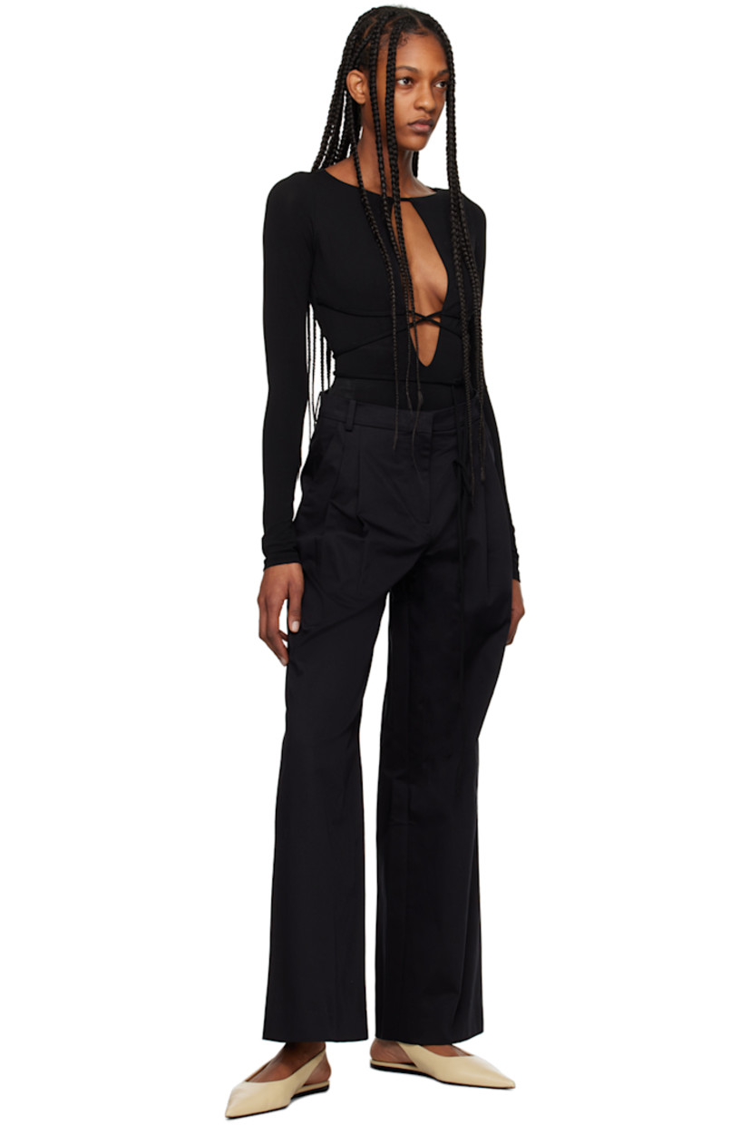 Wide-leg organic cotton twill trousers. 

· Belt loops
· Three-pocket styling
· Zip-fly
· Pleats at front 
· Full plain-woven lining

Supplier color: Black