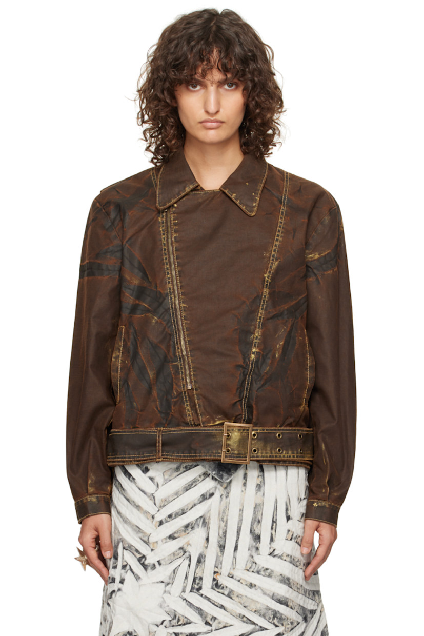 Recycled cotton-blend canvas jacket. Smudging, fading, and creasing throughout.

· Paneled construction
· Spread collar
· Offset zip closure
· Welt pockets
· Pin-buckle belt and belt loops at hem
· Pleats at single-button barrel cuffs
· Contrast stitching in yellow

Supplier color: Bronzed espresso