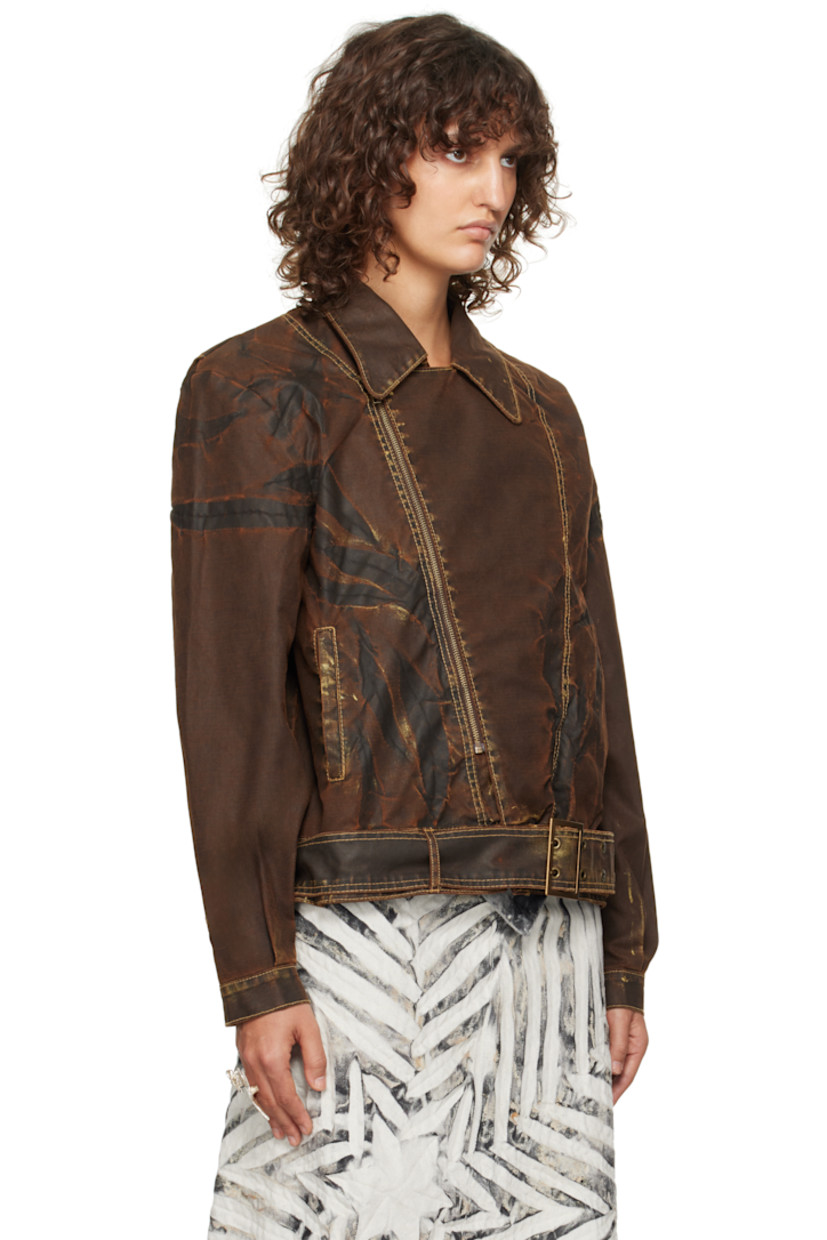 Recycled cotton-blend canvas jacket. Smudging, fading, and creasing throughout.

· Paneled construction
· Spread collar
· Offset zip closure
· Welt pockets
· Pin-buckle belt and belt loops at hem
· Pleats at single-button barrel cuffs
· Contrast stitching in yellow

Supplier color: Bronzed espresso