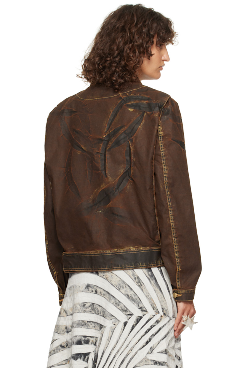 Recycled cotton-blend canvas jacket. Smudging, fading, and creasing throughout.

· Paneled construction
· Spread collar
· Offset zip closure
· Welt pockets
· Pin-buckle belt and belt loops at hem
· Pleats at single-button barrel cuffs
· Contrast stitching in yellow

Supplier color: Bronzed espresso