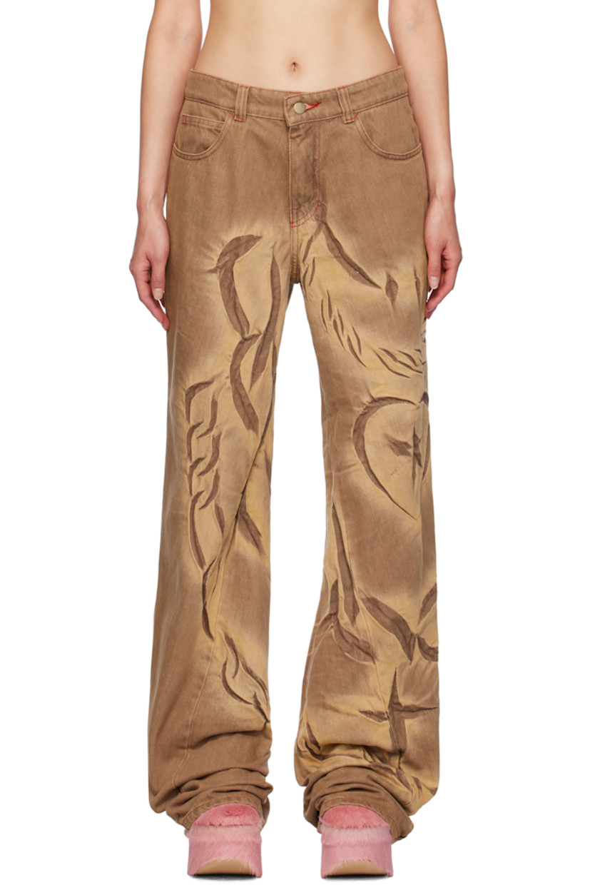 Non-stretch pre-consumer recycled cotton-blend denim jeans. Fading, creasing, and graphics throughout.

· Belt loops
· Five-pocket styling
· Zip-fly
· Twisted inseams and outseams
· Asymmetric cuffs
· Contrast stitching in red

Available exclusively at SSENSE.

Supplier color: Mocha fossil