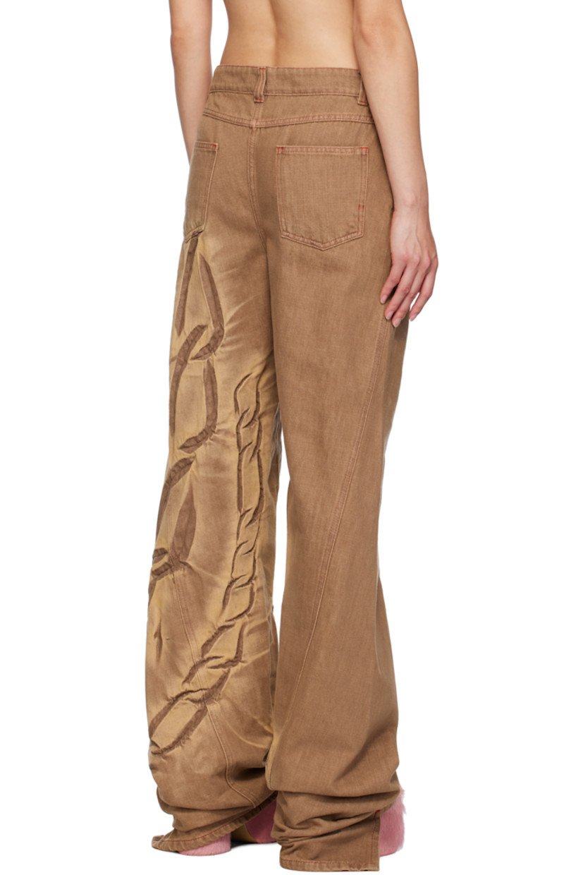 Non-stretch pre-consumer recycled cotton-blend denim jeans. Fading, creasing, and graphics throughout.

· Belt loops
· Five-pocket styling
· Zip-fly
· Twisted inseams and outseams
· Asymmetric cuffs
· Contrast stitching in red

Available exclusively at SSENSE.

Supplier color: Mocha fossil