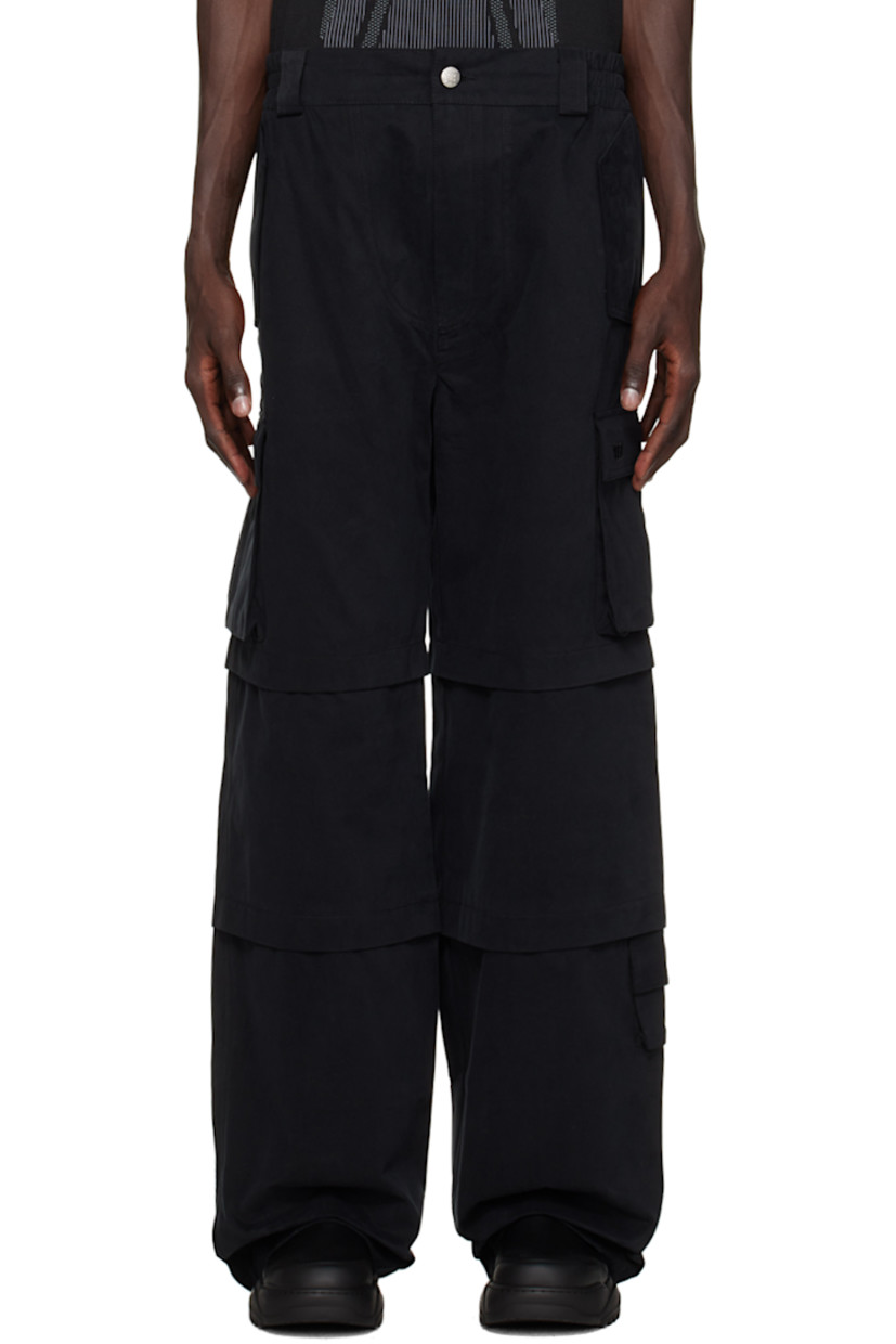 Cotton twill cargo pants.

· Belt loops at partially elasticized waistband
· Four-pocket styling
· Zip-fly
· Pleats at legs
· Cargo pocket at outseams
· Logo embroidered at pocket
· Flap pocket at outseam
· Logo-embossed silver-tone hardware

Supplier color: Black