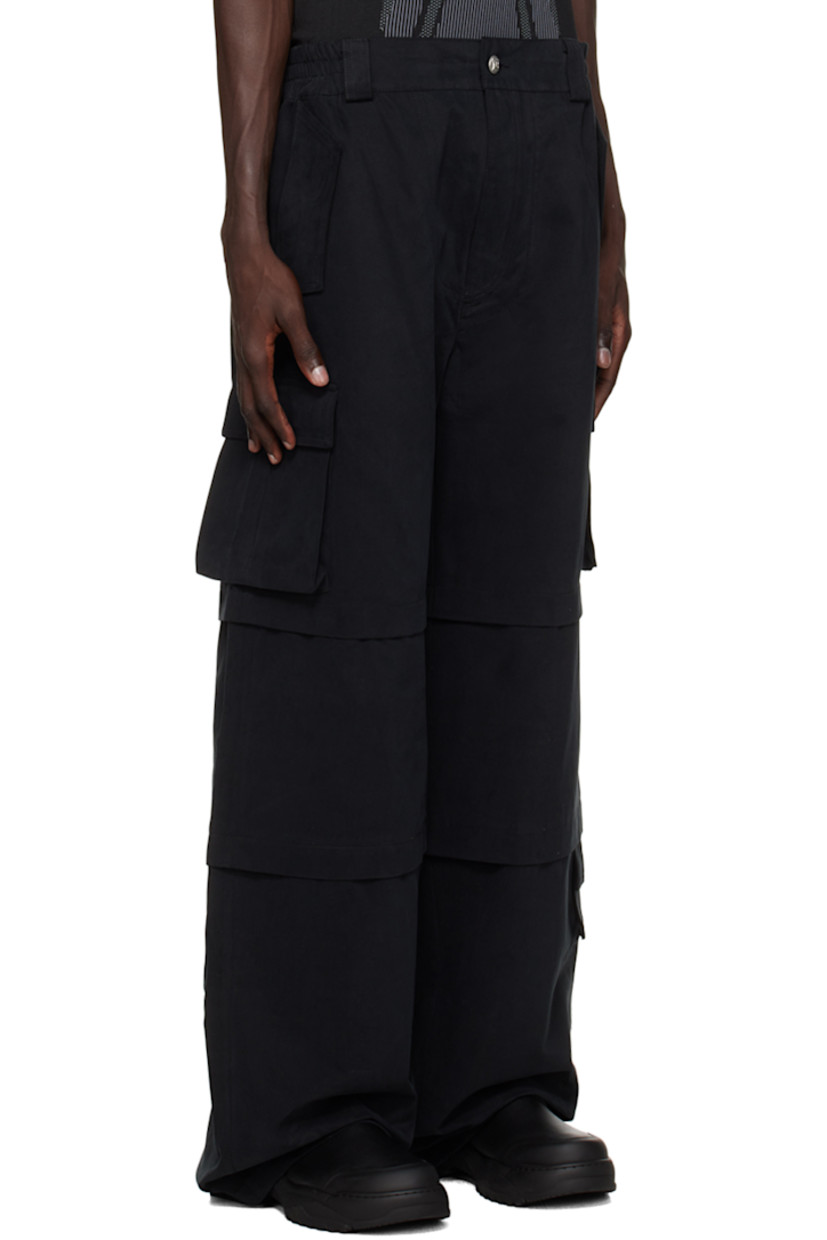 Cotton twill cargo pants.

· Belt loops at partially elasticized waistband
· Four-pocket styling
· Zip-fly
· Pleats at legs
· Cargo pocket at outseams
· Logo embroidered at pocket
· Flap pocket at outseam
· Logo-embossed silver-tone hardware

Supplier color: Black