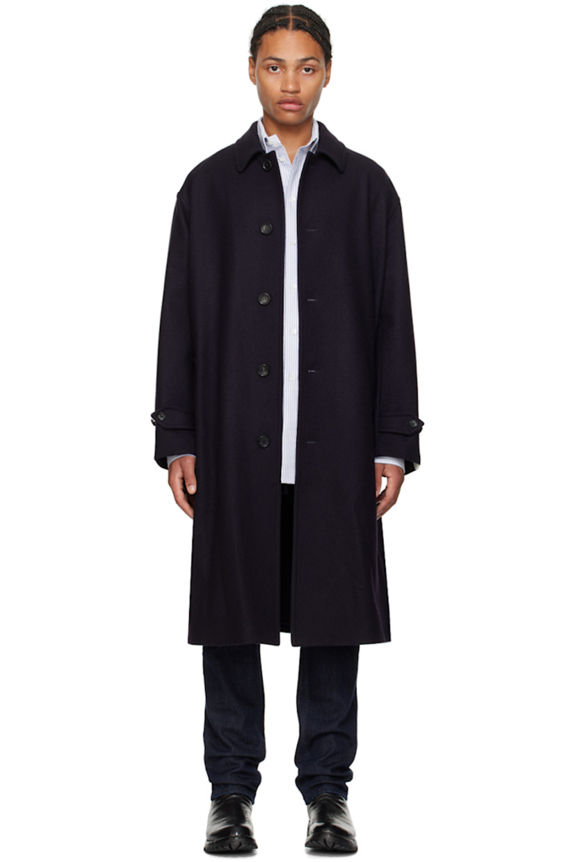Brushed virgin wool coat.

· Spread collar
· Button closure
· Welt pockets
· Belt loops and detachable pin-buckle belt
· Adjustable button tab at cuffs
· Logo flag at cuff
· Welt pockets at interior
· Full satin lining

Supplier color: Navy