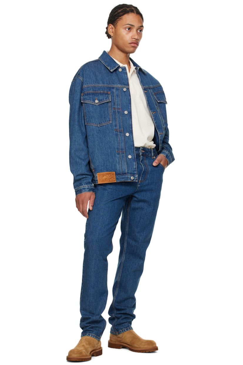 Non-stretch denim jeans.

· Belt loops
· Five-pocket styling
· Zip-fly
· Logo patch at back waistband
· Logo-engraved silver-tone hardware
· Contrast stitching in tan

Supplier color: Denim