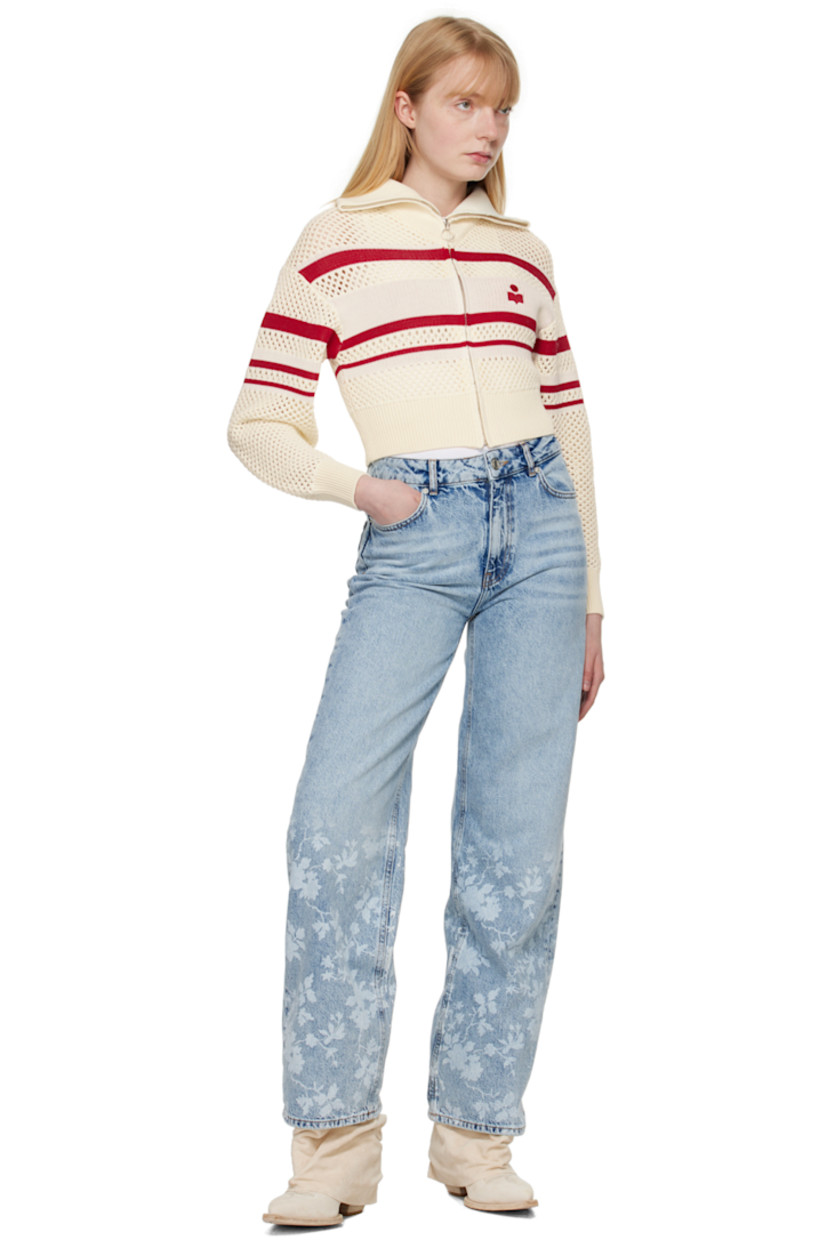 Wide-leg non-stretch organic cotton denim jeans. Fading and whiskering throughout.

· High-rise
· Belt loops
· Five-pocket styling
· Zip-fly
· Floral pattern printed at cuffs
· Leather logo patch at back waistband
· Logo-engraved silver-tone hardware
· Contrast stitching in tan

Supplier color: Mid blue