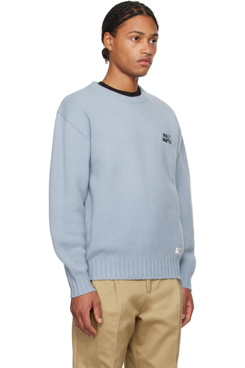 Knit wool-blend sweater.

· Rib-knit crewneck, hem, and cuffs
· Logo embroidered at chest
· Logo patch at front hem
· Dropped shoulders

Supplier color: Blue