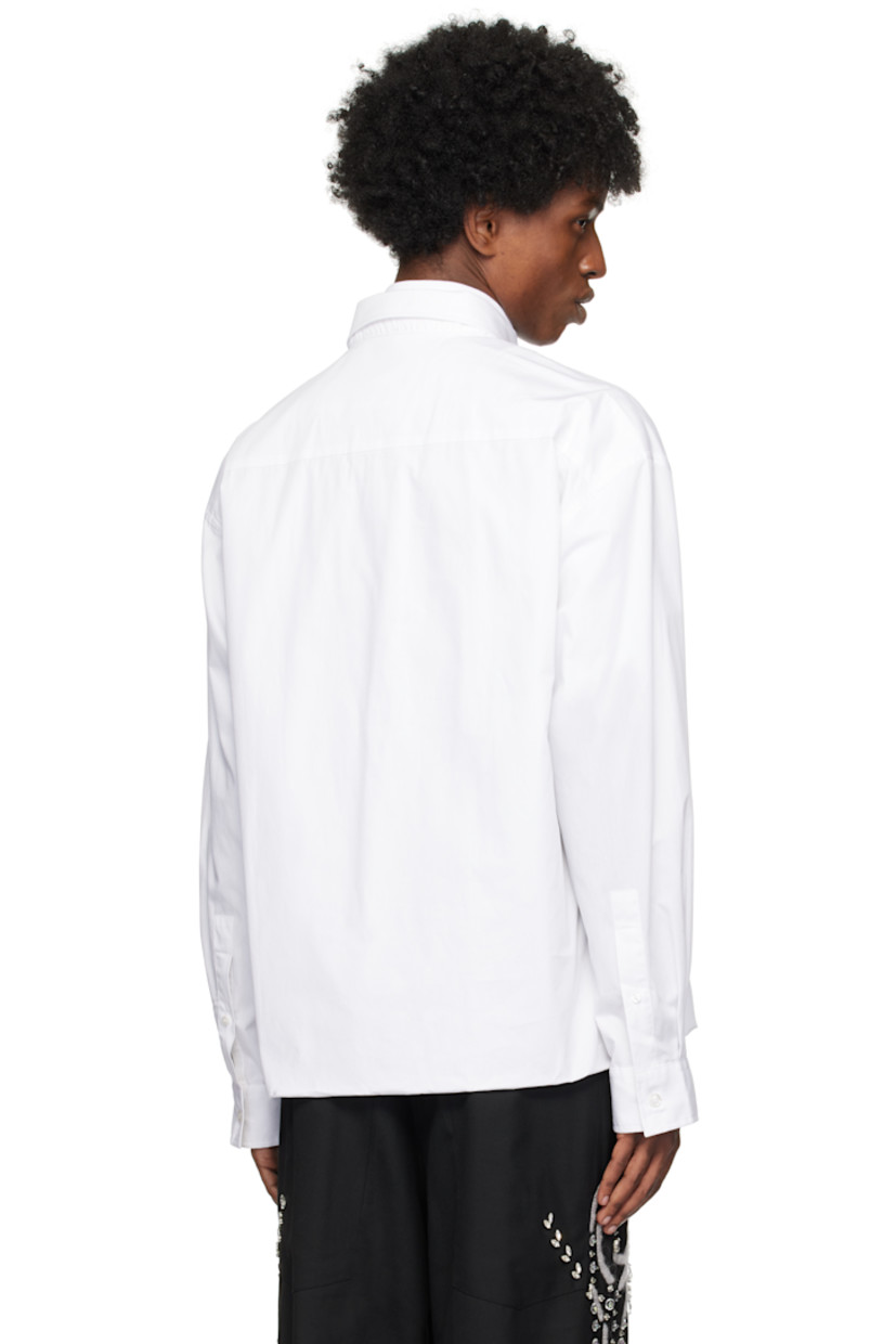 Poplin cotton shirt.

· Layered construction
· Short sleeves
· Rib-knit stand collar with half-zip placket
· Logo patch at chest
· Single-piece bodice
· Integrated long-sleeve shirt overlay
· Button-down spread collar at overlay
· Button placket and barrel cuffs
· Box pleat at back

Supplier color: White
