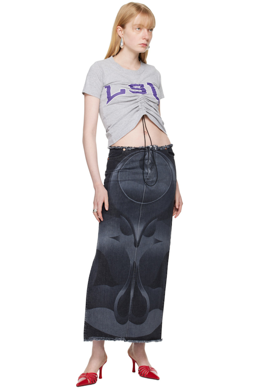 Non-stretch denim skirt. Graphic pattern printed throughout.

· Frayed edge at waist and hem
· Four-pocket styling
· Button-fly
· Vented side seam
· Logo patch at back waistband

Supplier color: Black