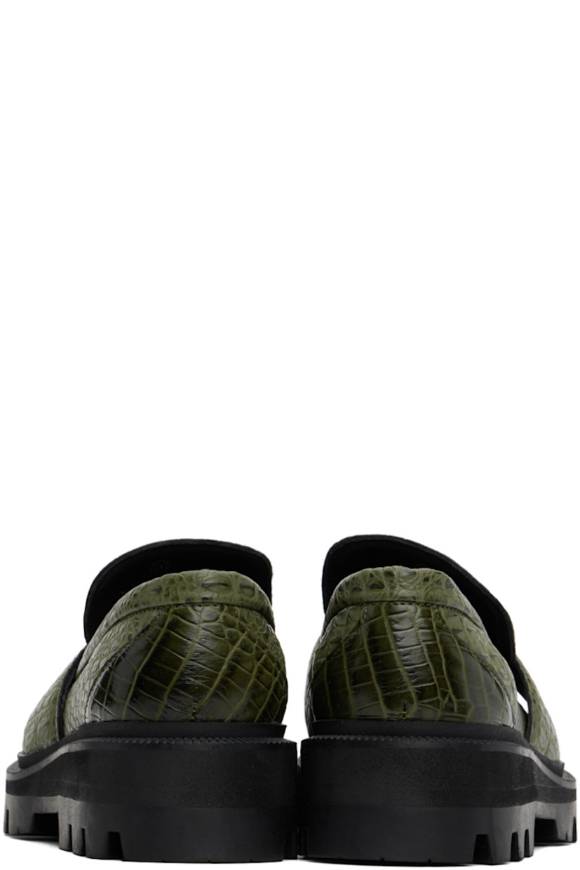 Croc-embossed faux-leather loafers in green.

· Square moc toe
· Logo hardware and strap at vamp
· Logo embossed at padded footbed
· Foam rubber midsole
· Lugged rubber sole
· Heel: H2.75"

Supplier color: Green